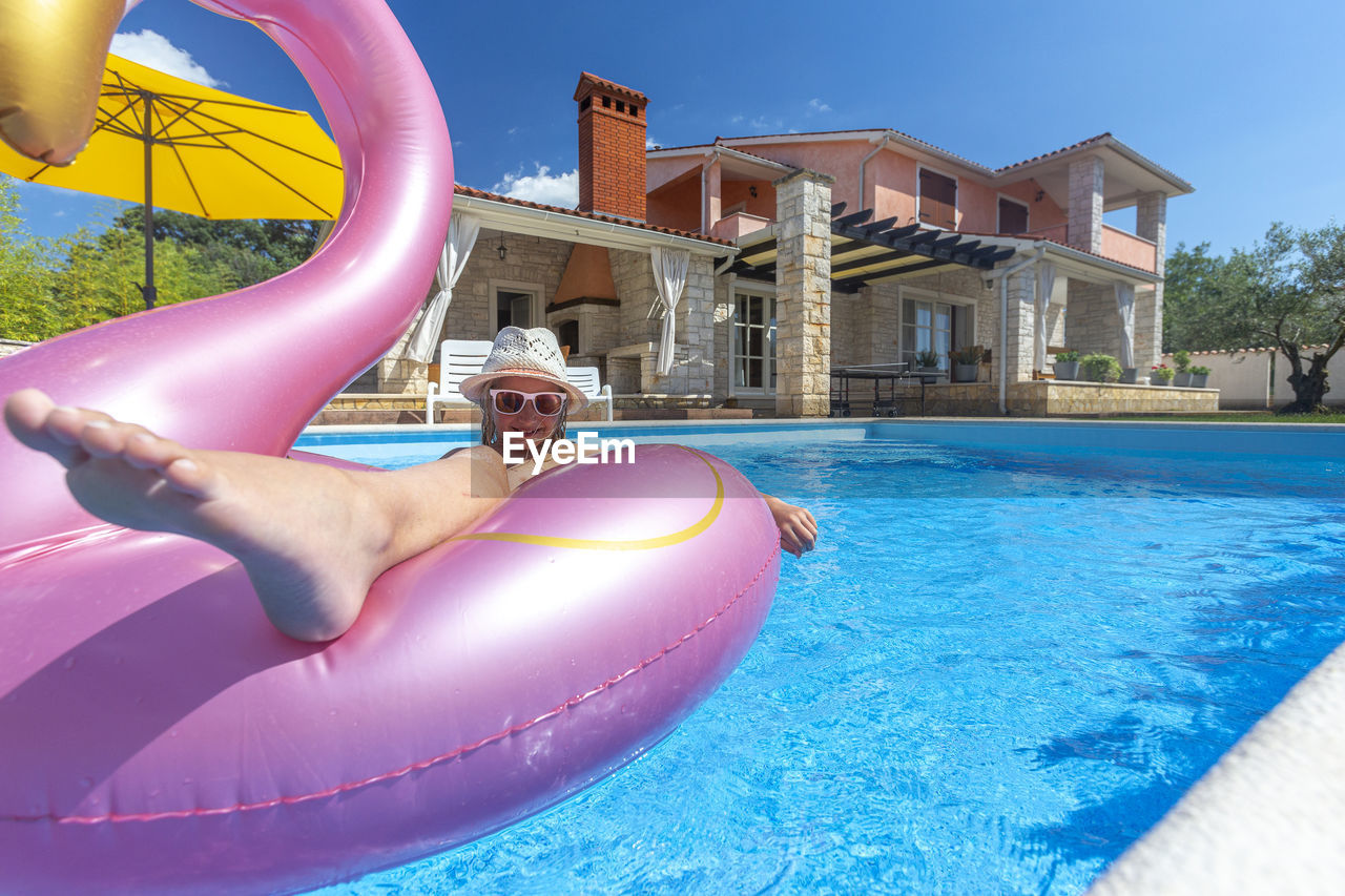 Low section of woman in swimming pool