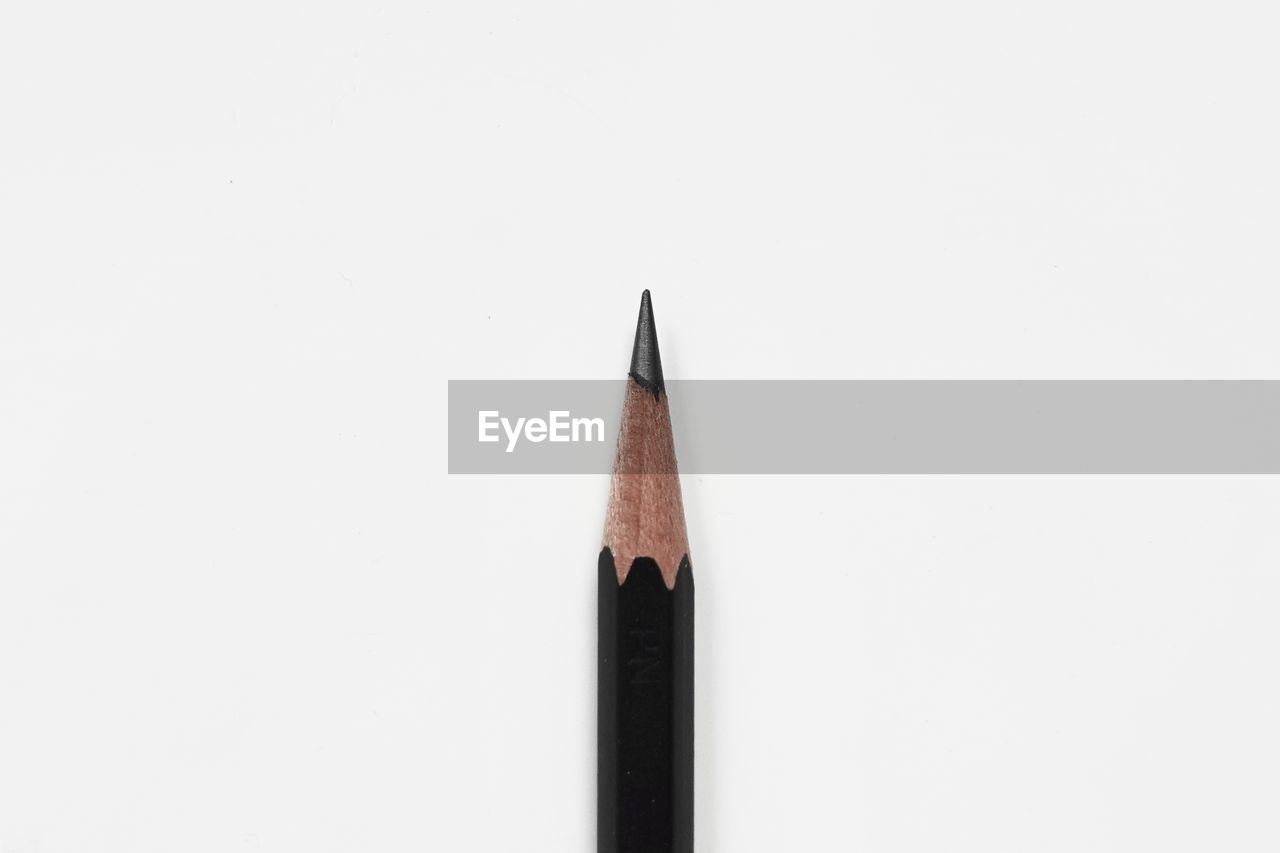 HIGH ANGLE VIEW OF PENCIL ON WHITE BACKGROUND