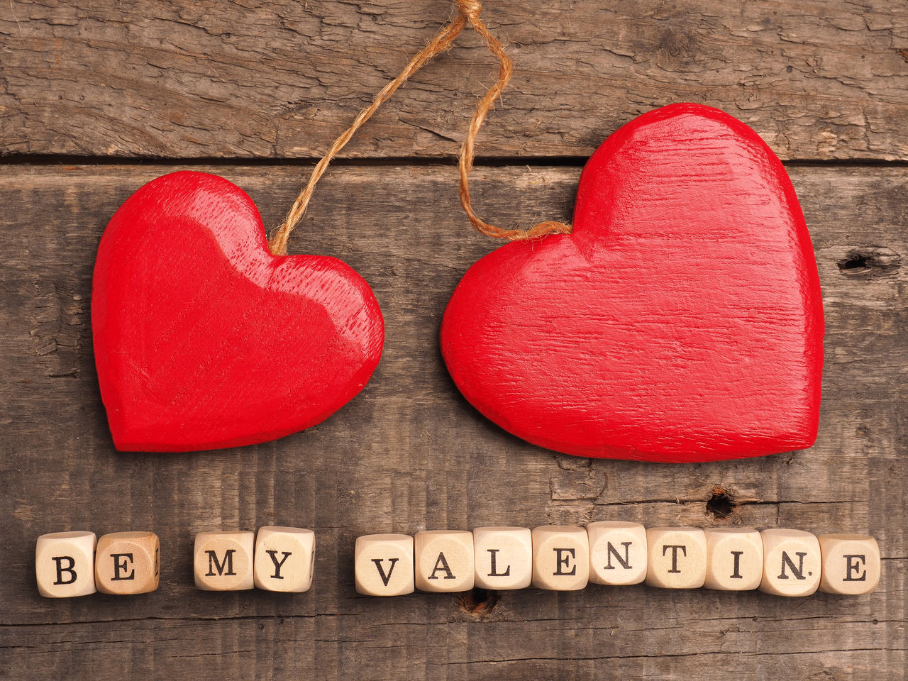 Close-up of heart shaped decor and text on table