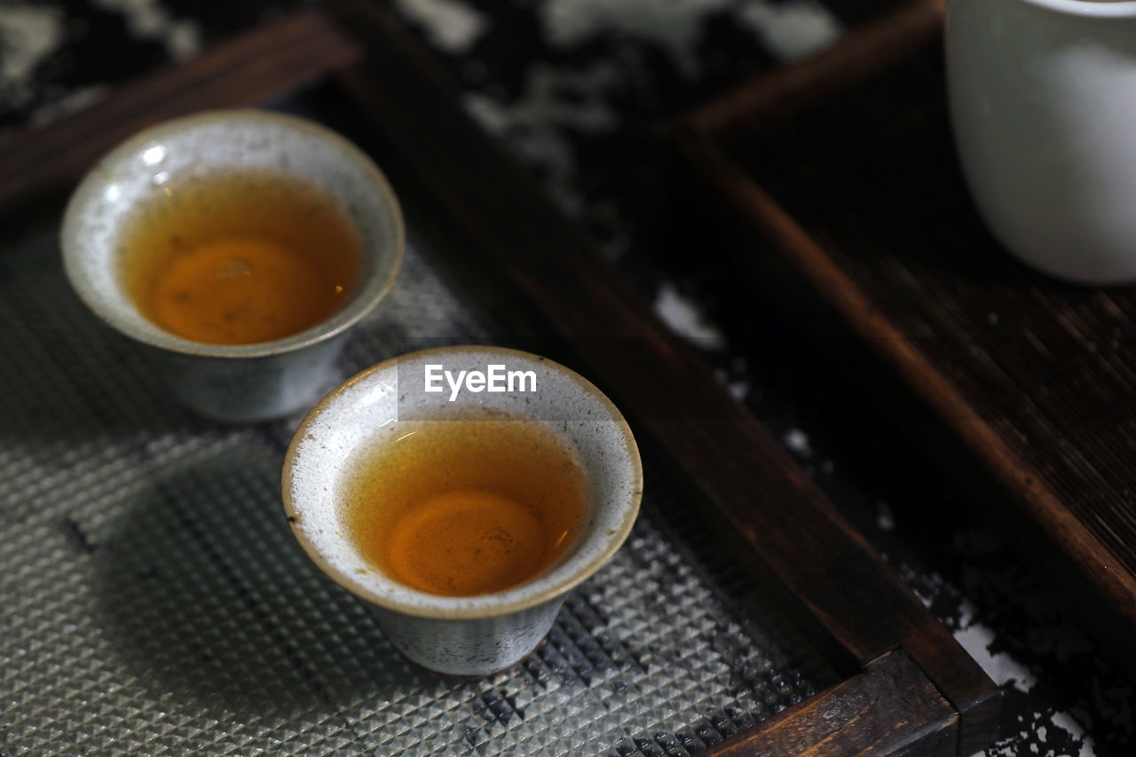 High angle view of tea in cups on table