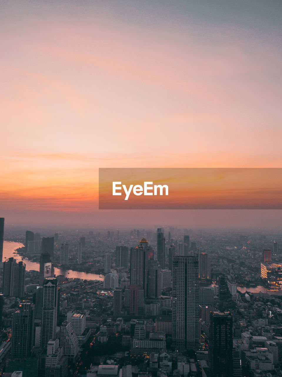 Cityscape against sky during sunset