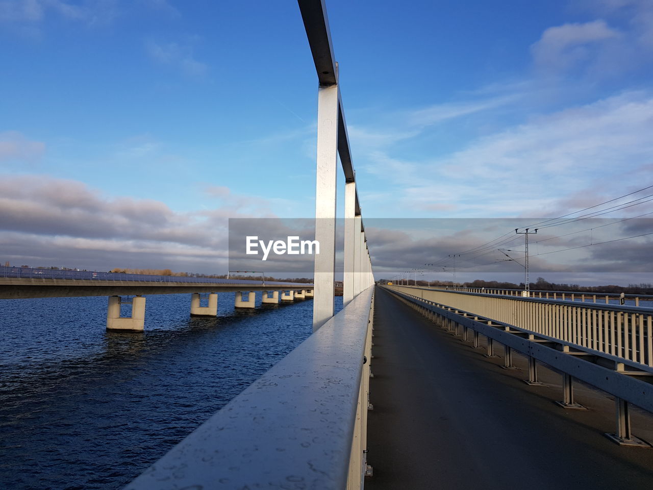 Bridge over sea against sky