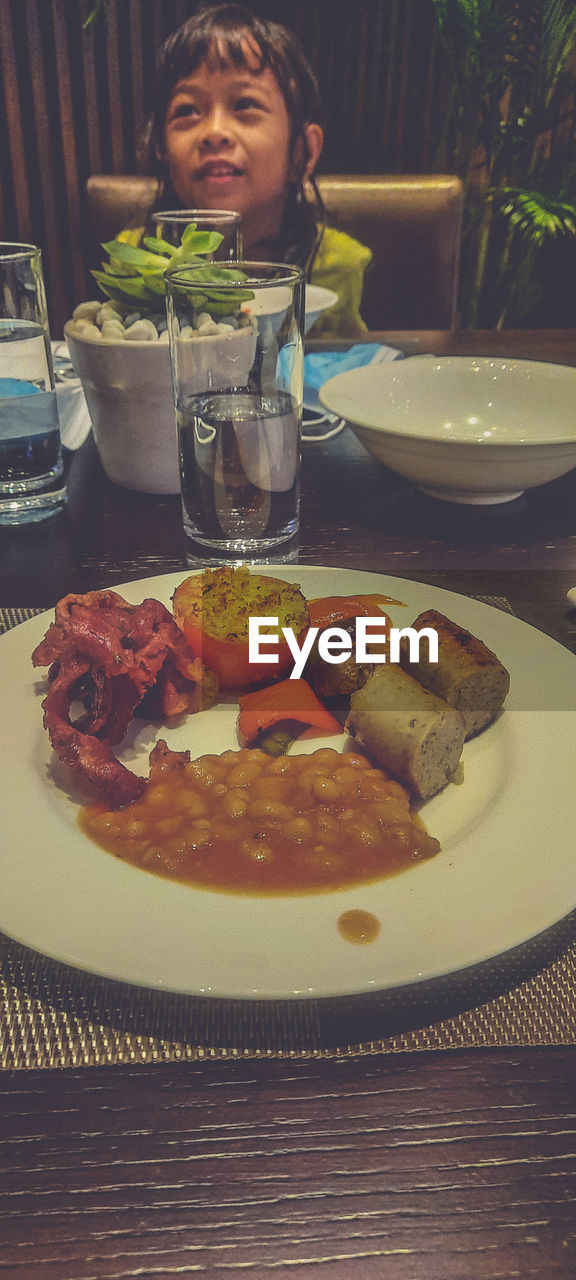 HIGH ANGLE VIEW OF WOMAN HAVING FOOD