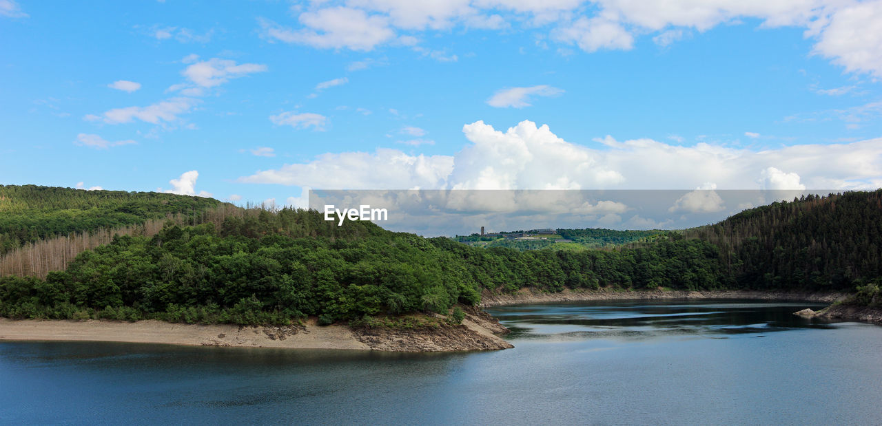 PANORAMIC VIEW OF RIVER AMIDST TREES AGAINST SKY