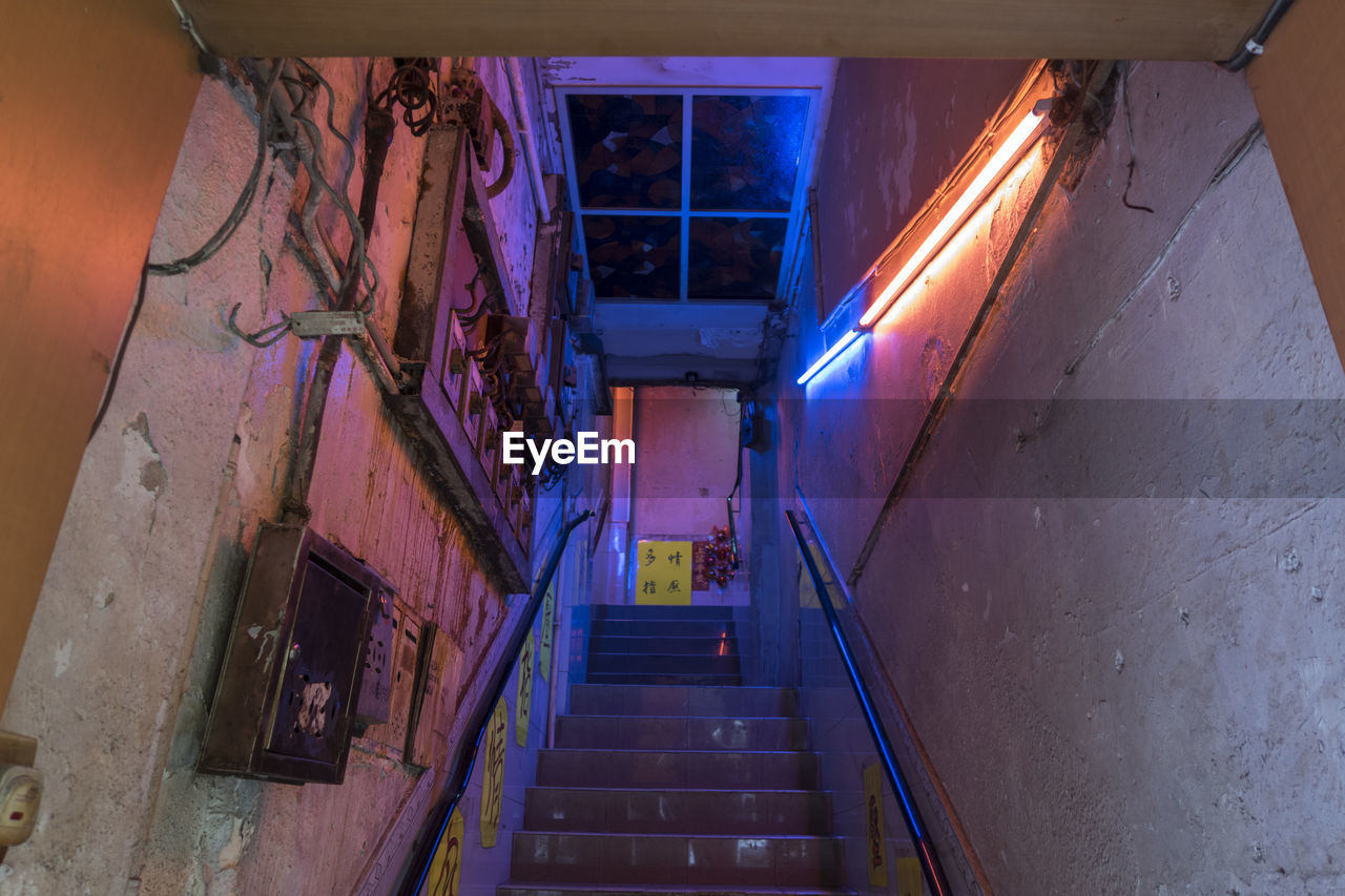 Low angle view of staircase in building, hong kong