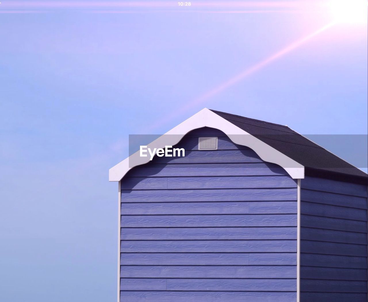 LOW ANGLE VIEW OF BUILT STRUCTURES AGAINST BLUE SKY