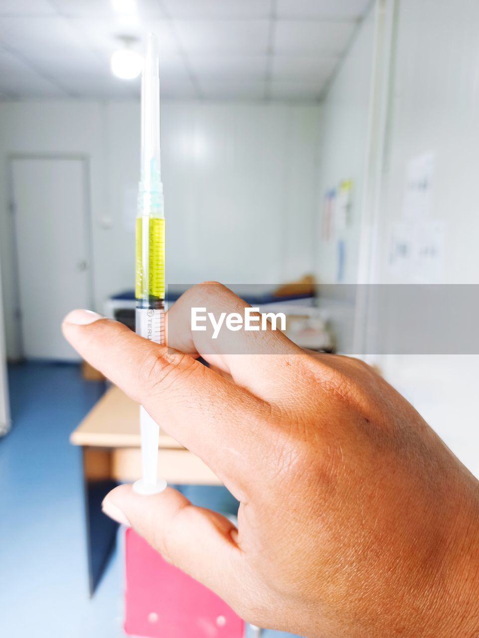 Cropped hand of scientist working in laboratory