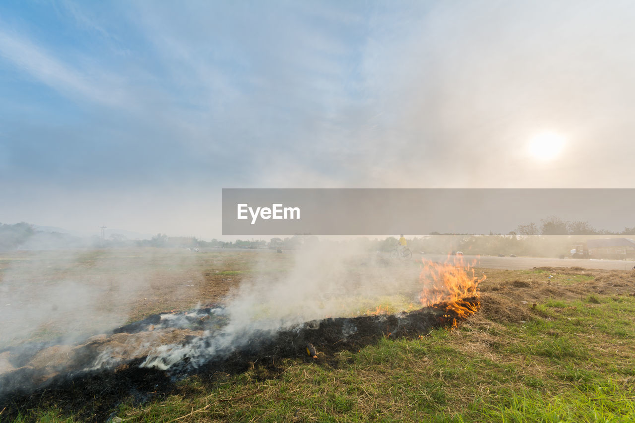 Fire on field against sky