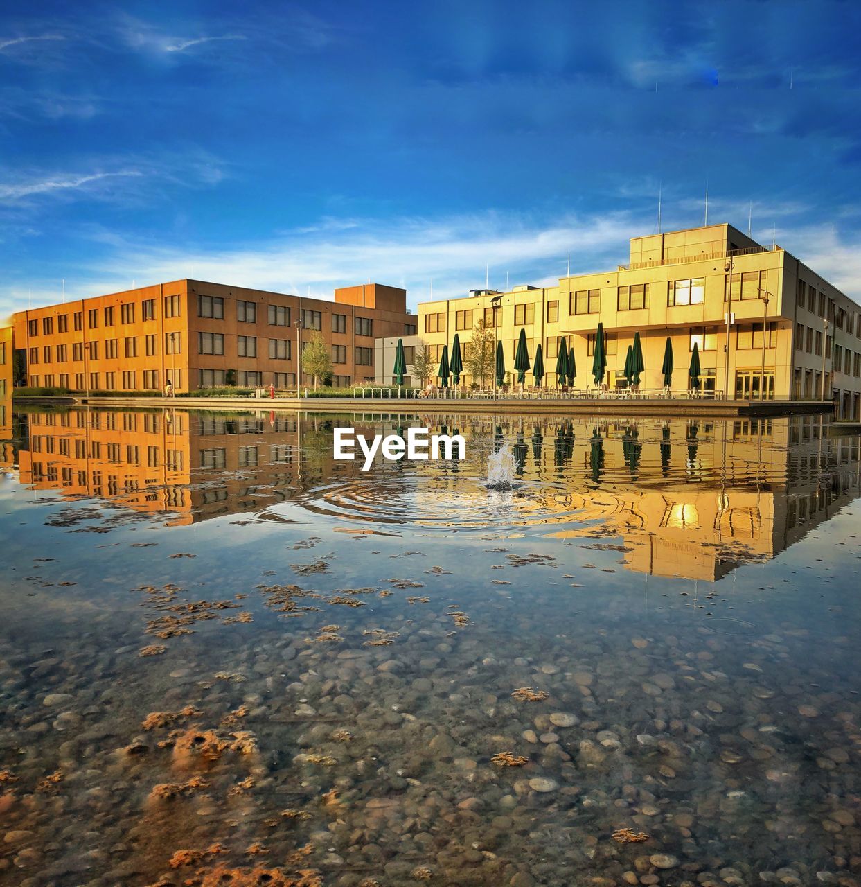 REFLECTION OF BUILDINGS IN WATER