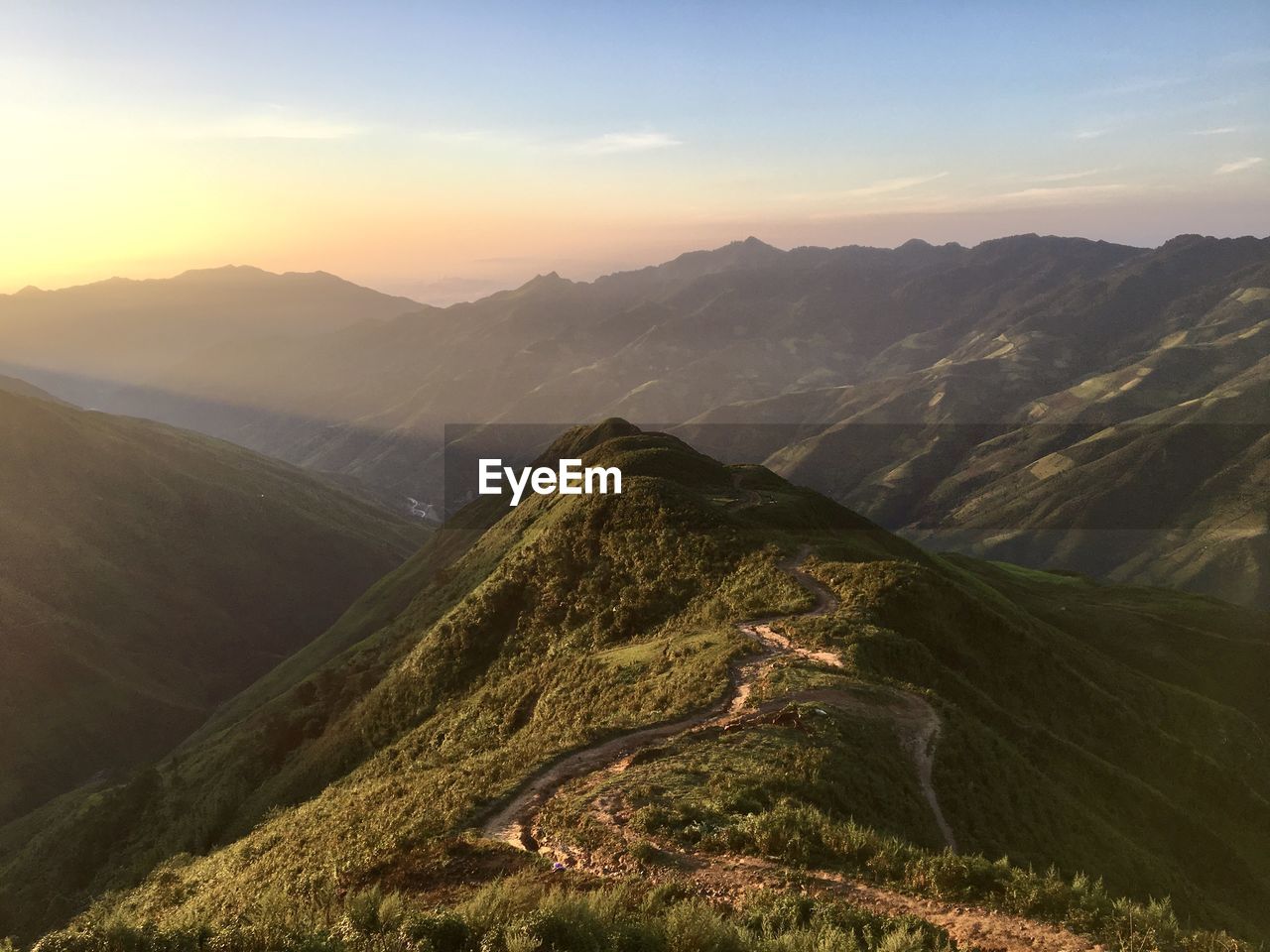 Scenic view of mountains against sky during sunset