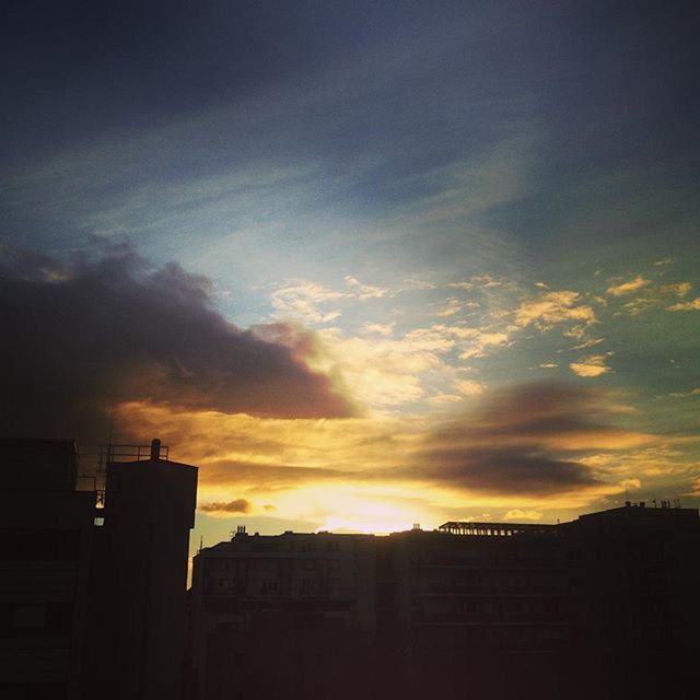 LOW ANGLE VIEW OF BUILT STRUCTURE AT SUNSET