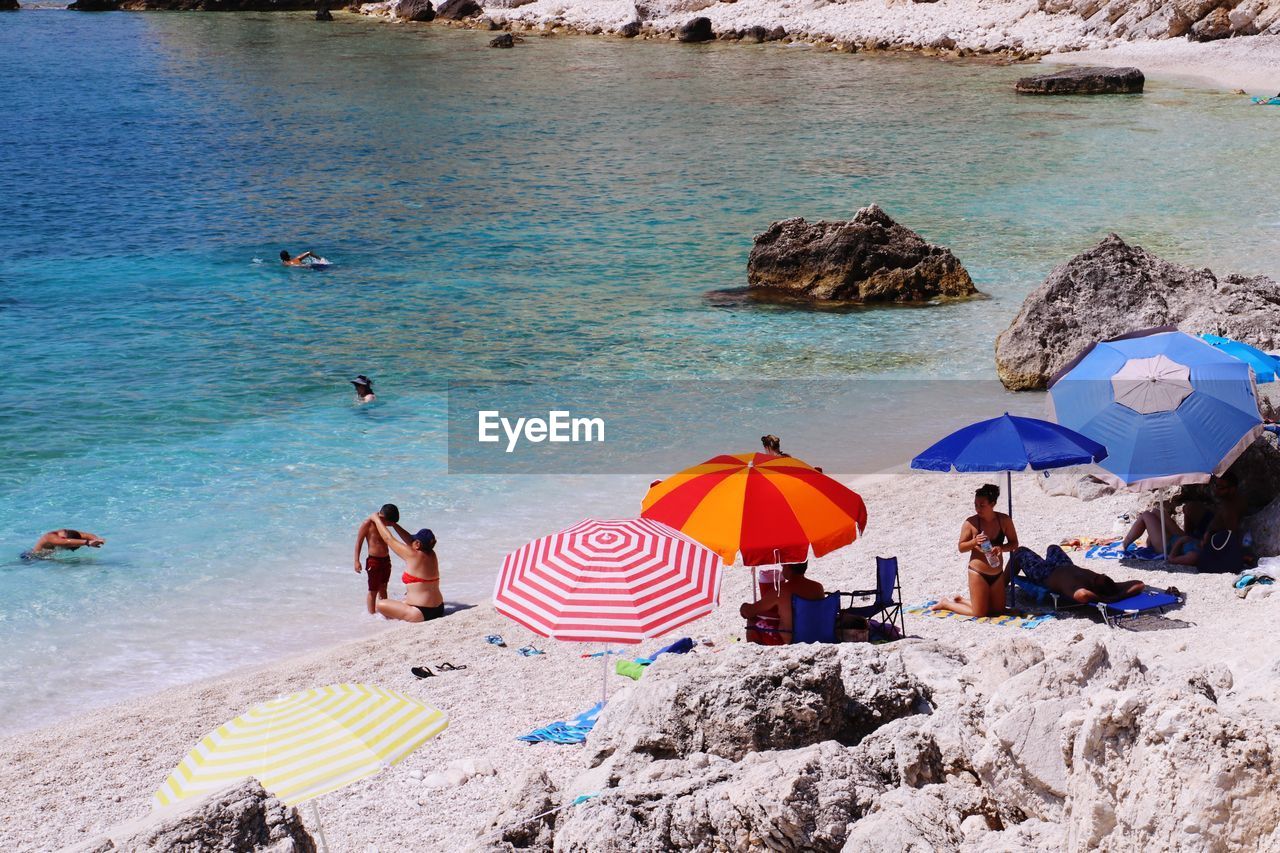 Group of people at beach during summer