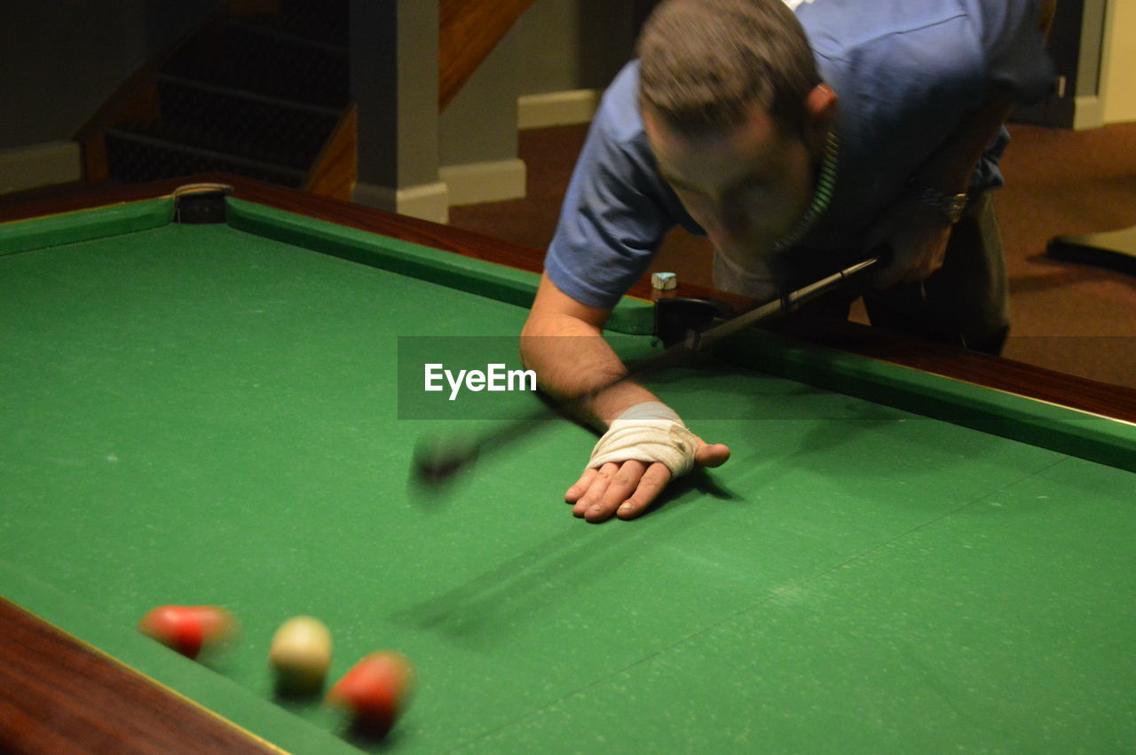 Young man playing snooker