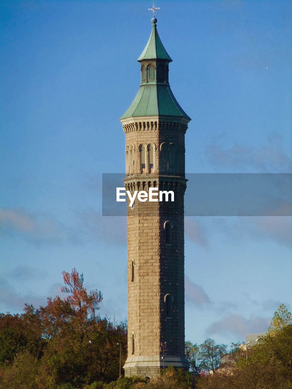 LOW ANGLE VIEW OF CLOCK TOWER IN CITY