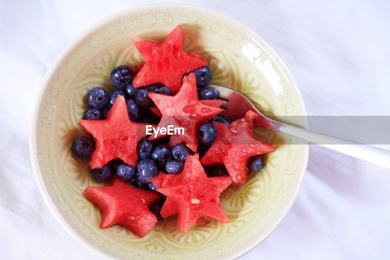 High angle view of star shape watermelons and blueberries in bowl