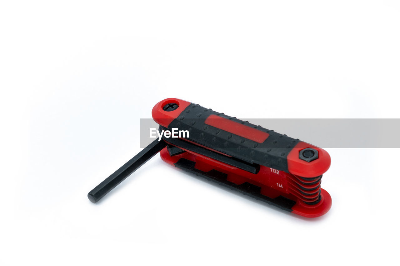 HIGH ANGLE VIEW OF RED TOY ON WHITE BACKGROUND