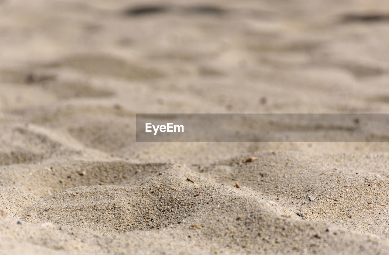 Selective focus natural background photo of sand on beach.