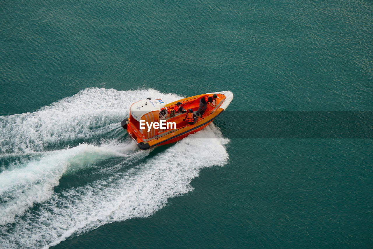 HIGH ANGLE VIEW OF BOAT ON SEA SHORE