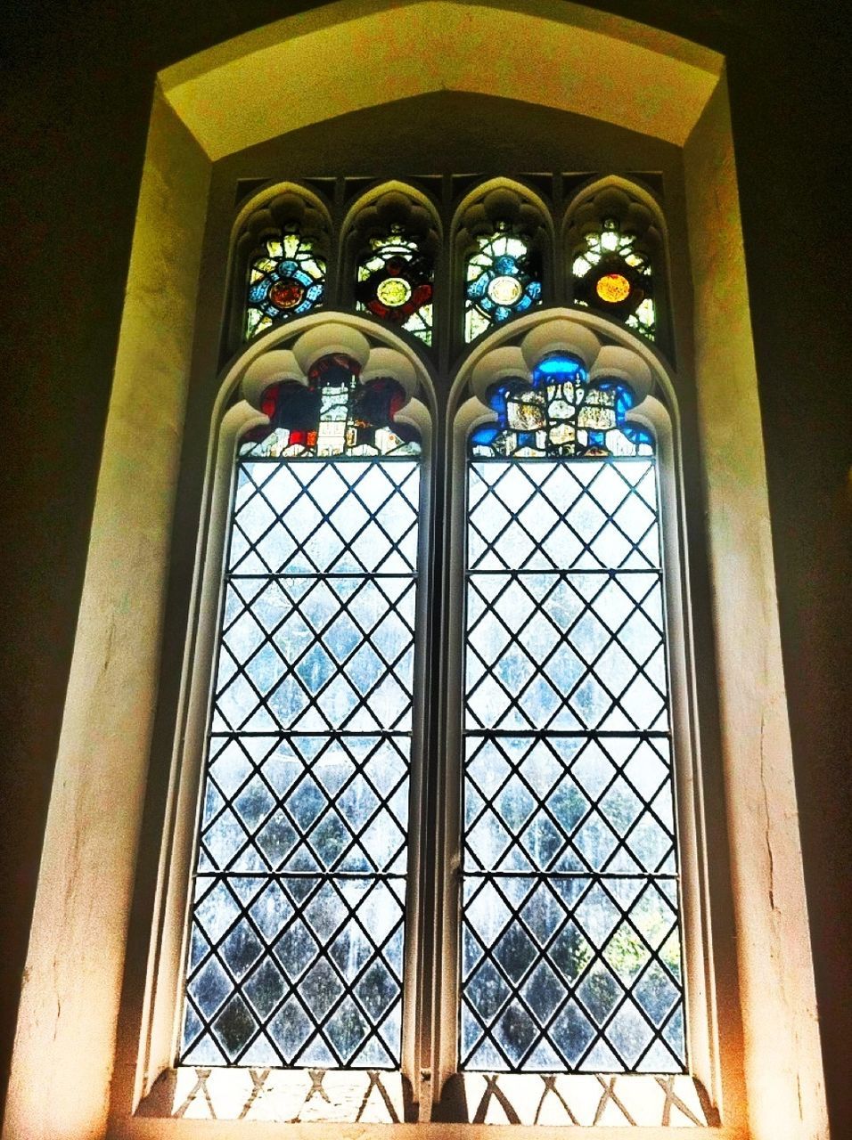 LOW ANGLE VIEW OF CHURCH WITH WINDOWS