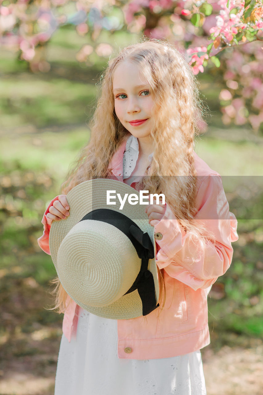 Portrait of girl standing outdoors