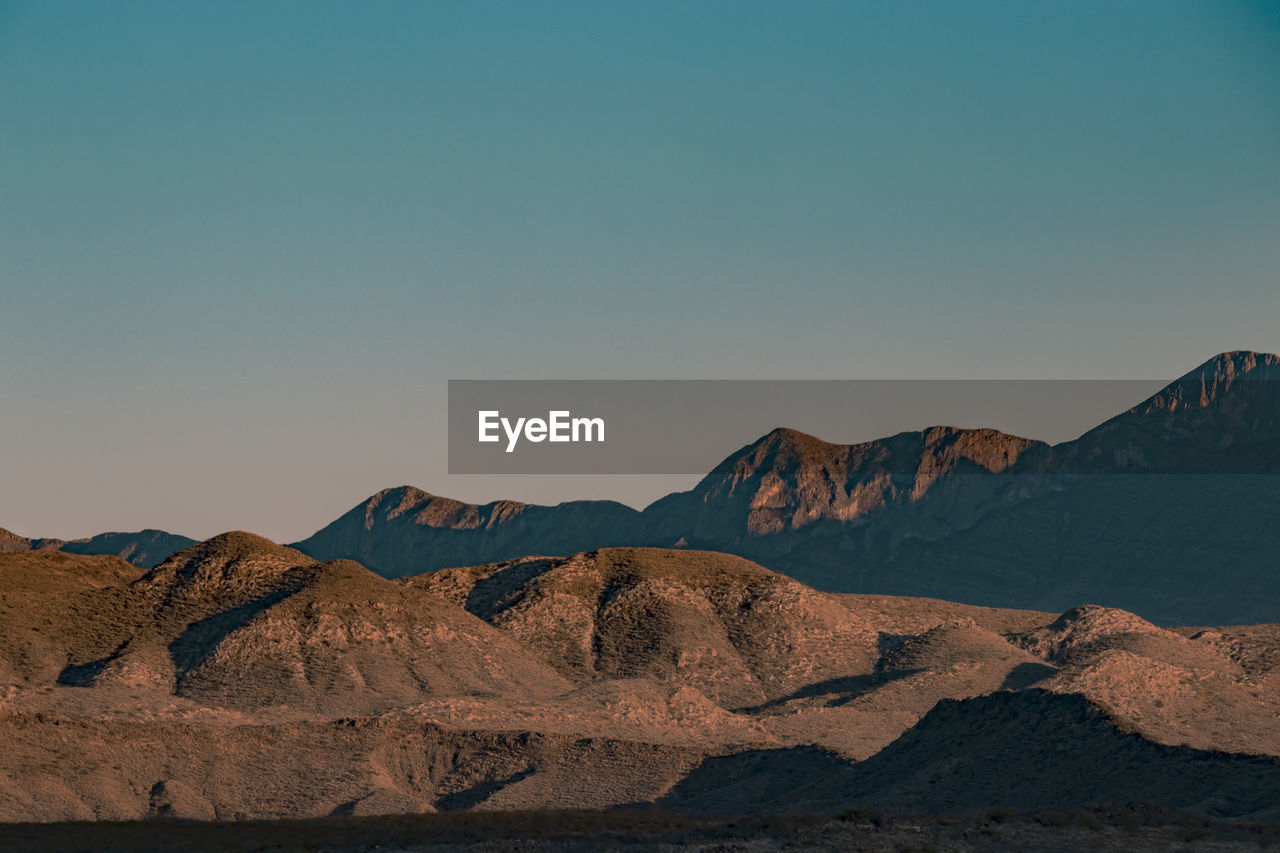 Scenic view of mountains against sky during sunset