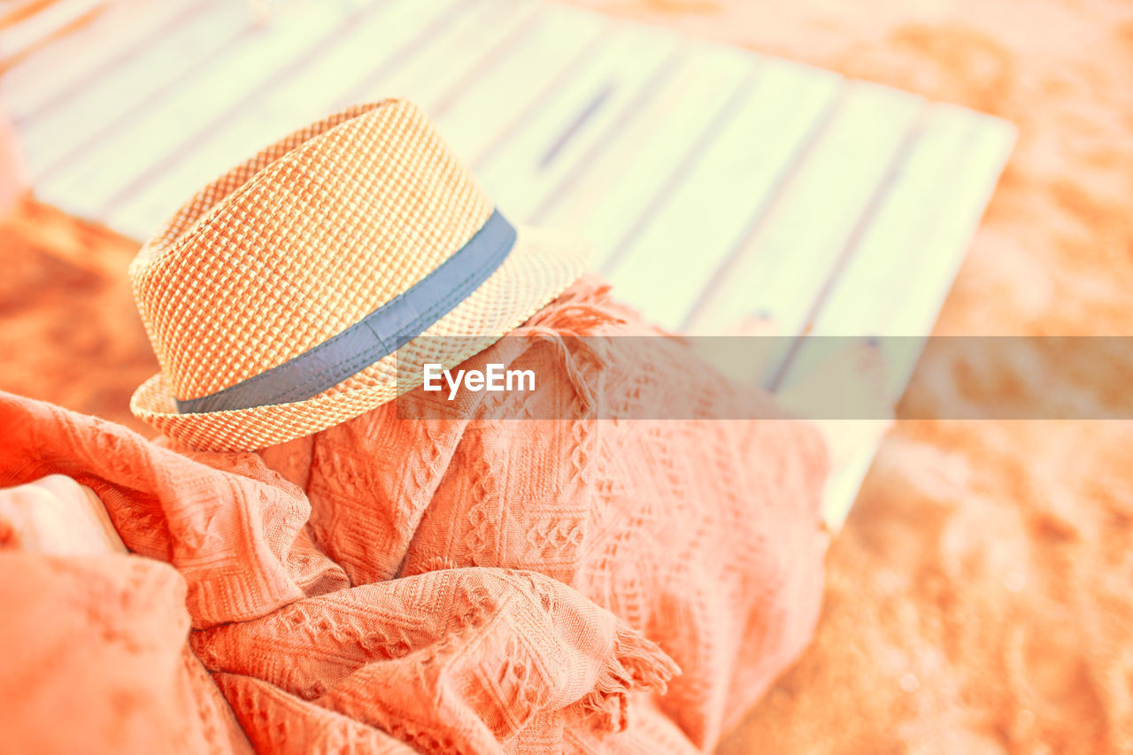 HIGH ANGLE VIEW OF HAT ON TABLE DURING HOME