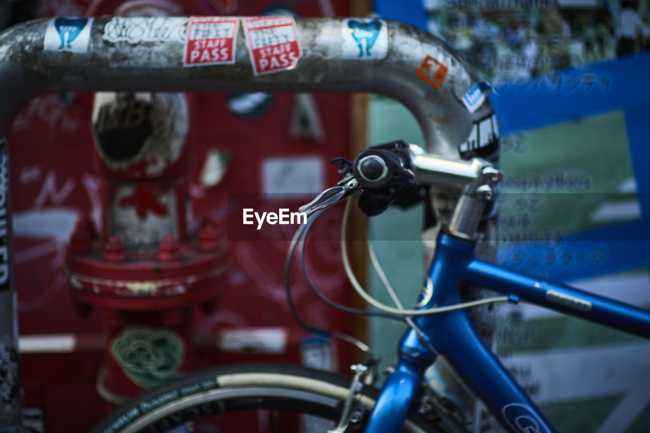 Cropped image of bicycle at parking station