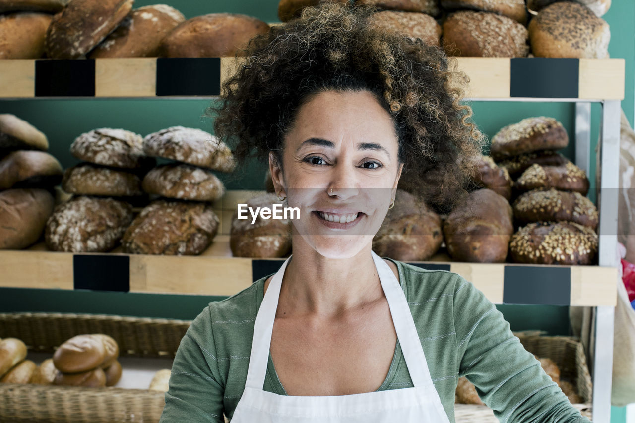 Portrait of smiling female owner in bakery