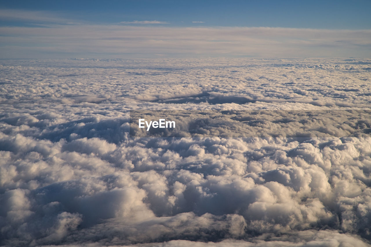 AERIAL VIEW OF CLOUDS OVER LANDSCAPE