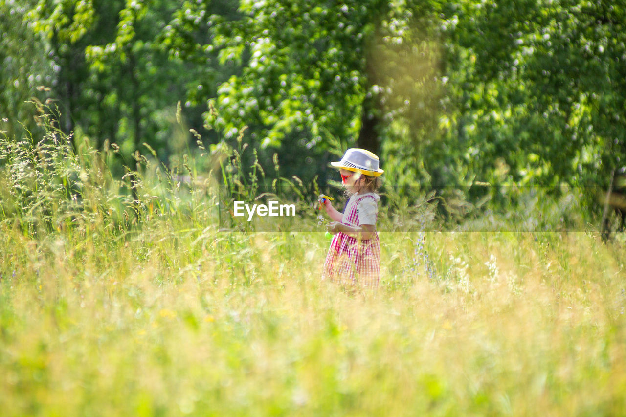 FULL LENGTH OF CHILD ON FIELD