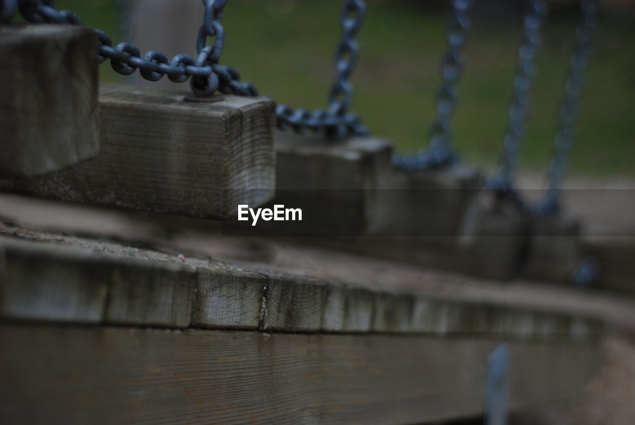 Close-up of chain on bridge, playground