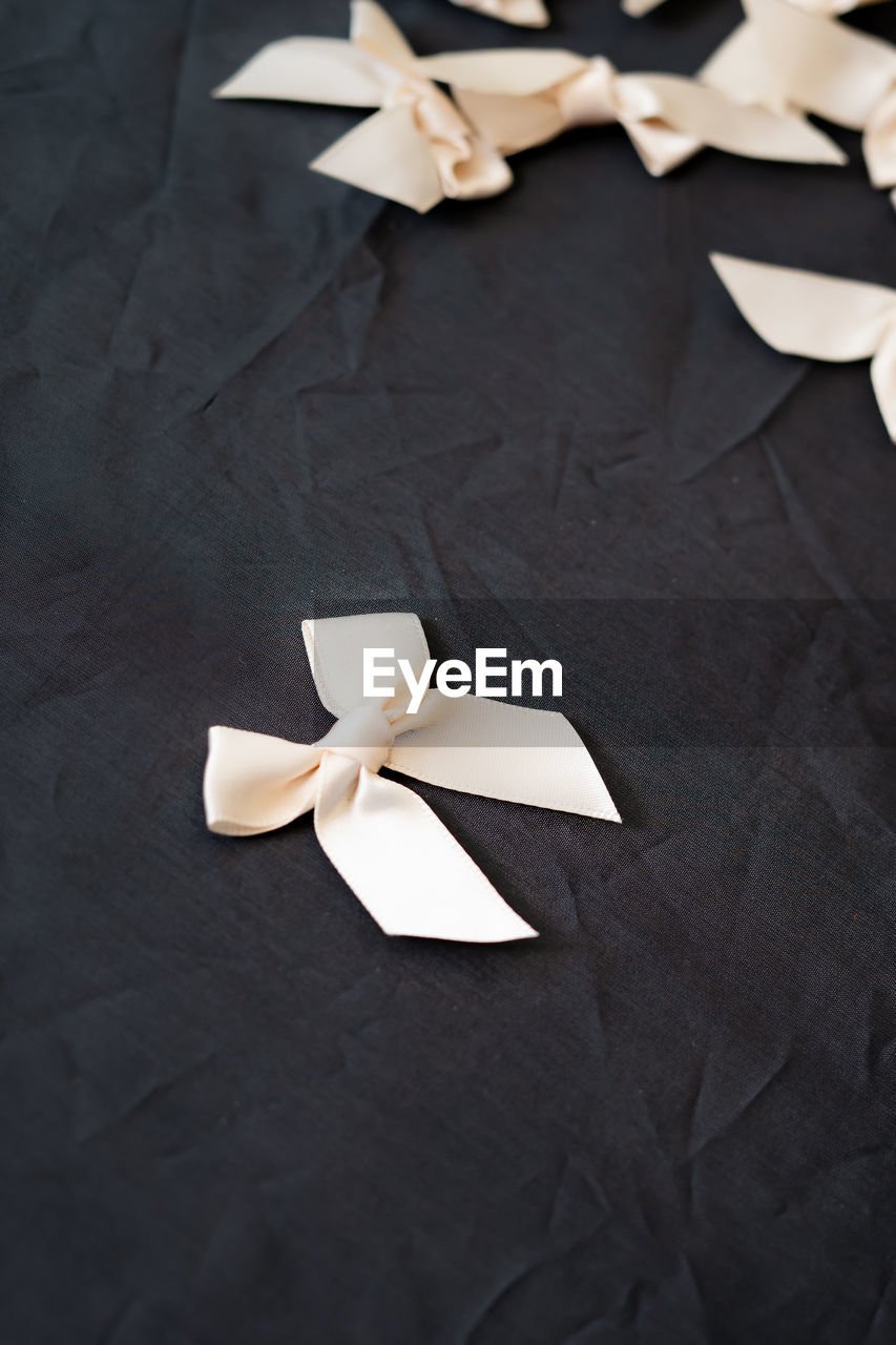 White silk ribbons isolated on the black background.