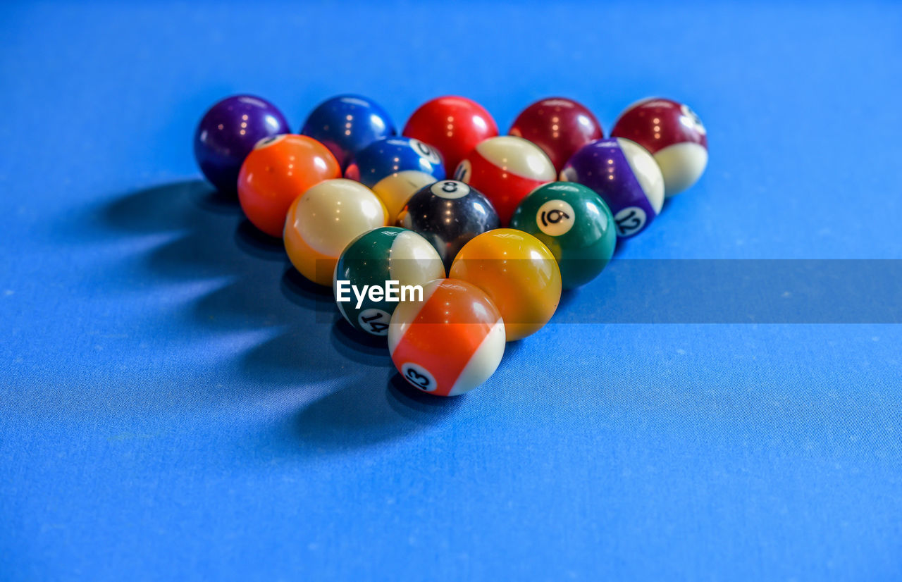 Close-up of pool balls arranged on table