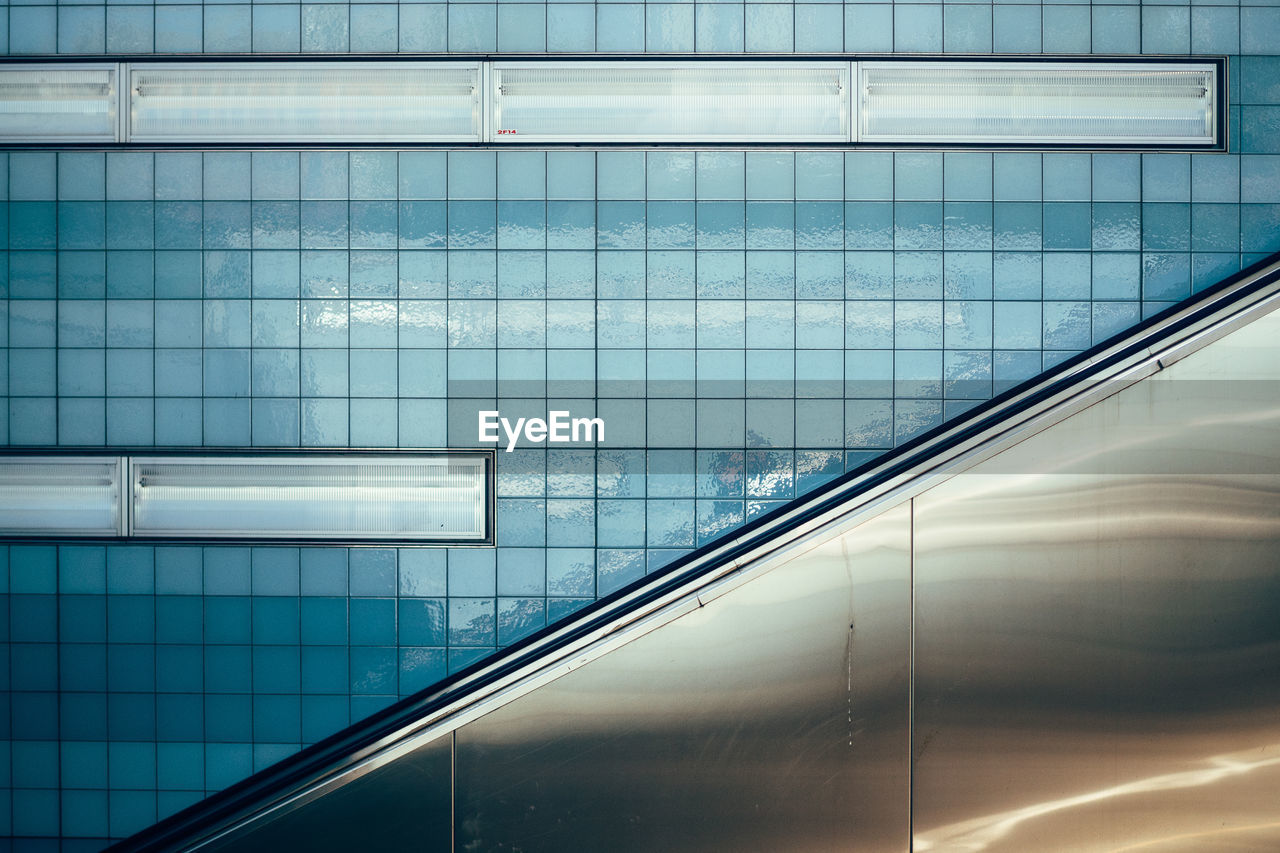 Backgrounds of subway station wall with escalator