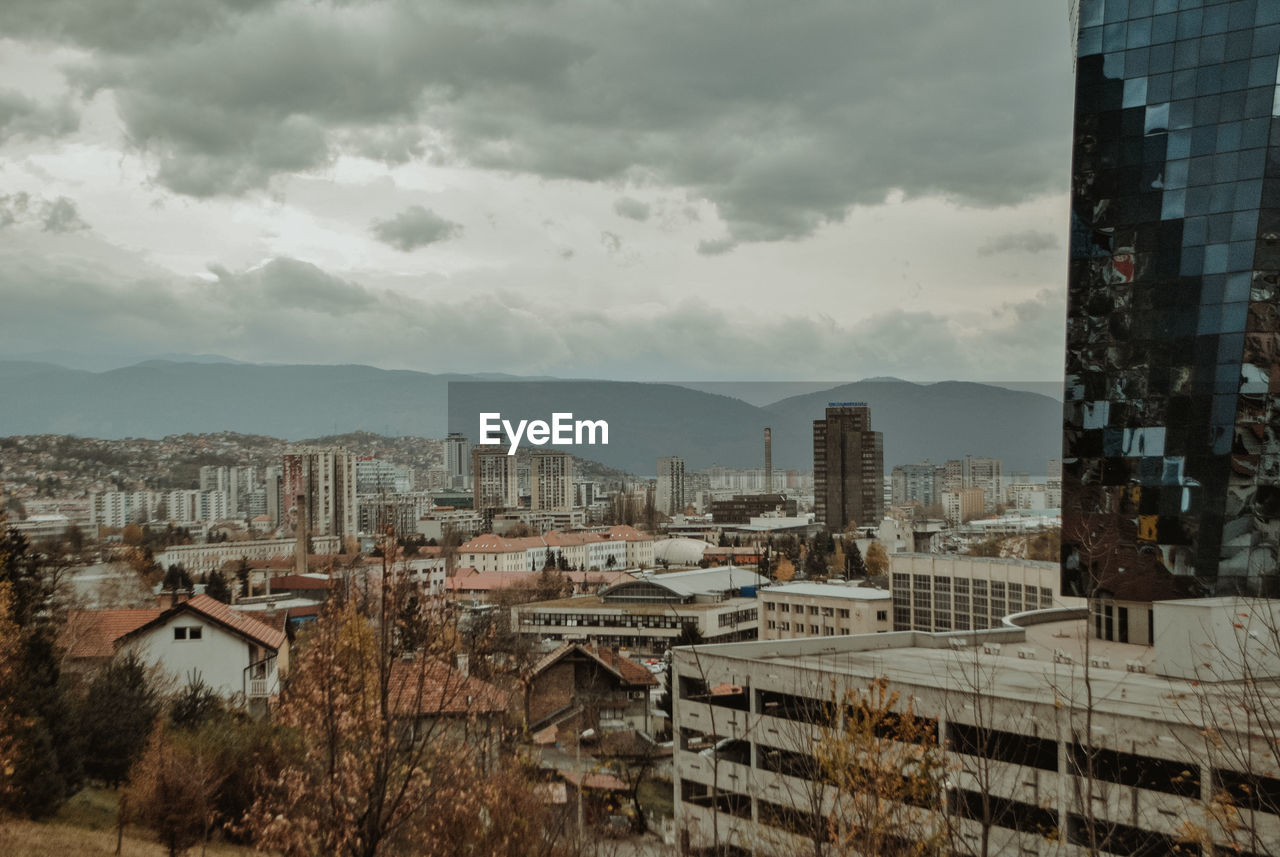 High angle view of buildings in city against sky