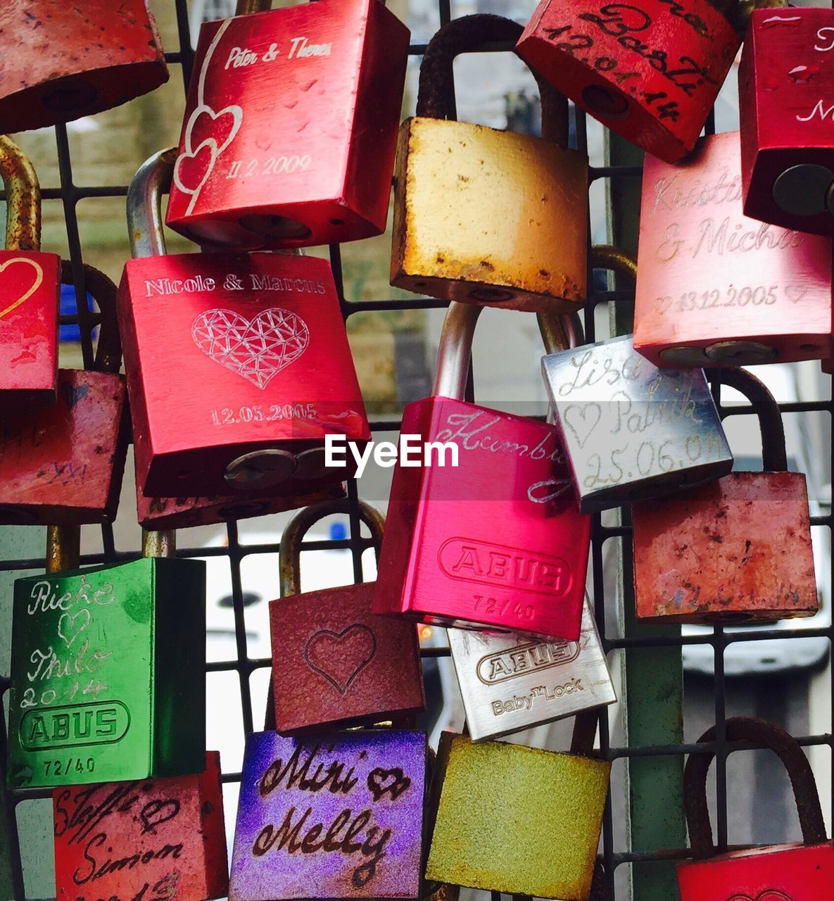 FULL FRAME SHOT OF LOVE PADLOCKS IN TRADITIONAL CLOTHING