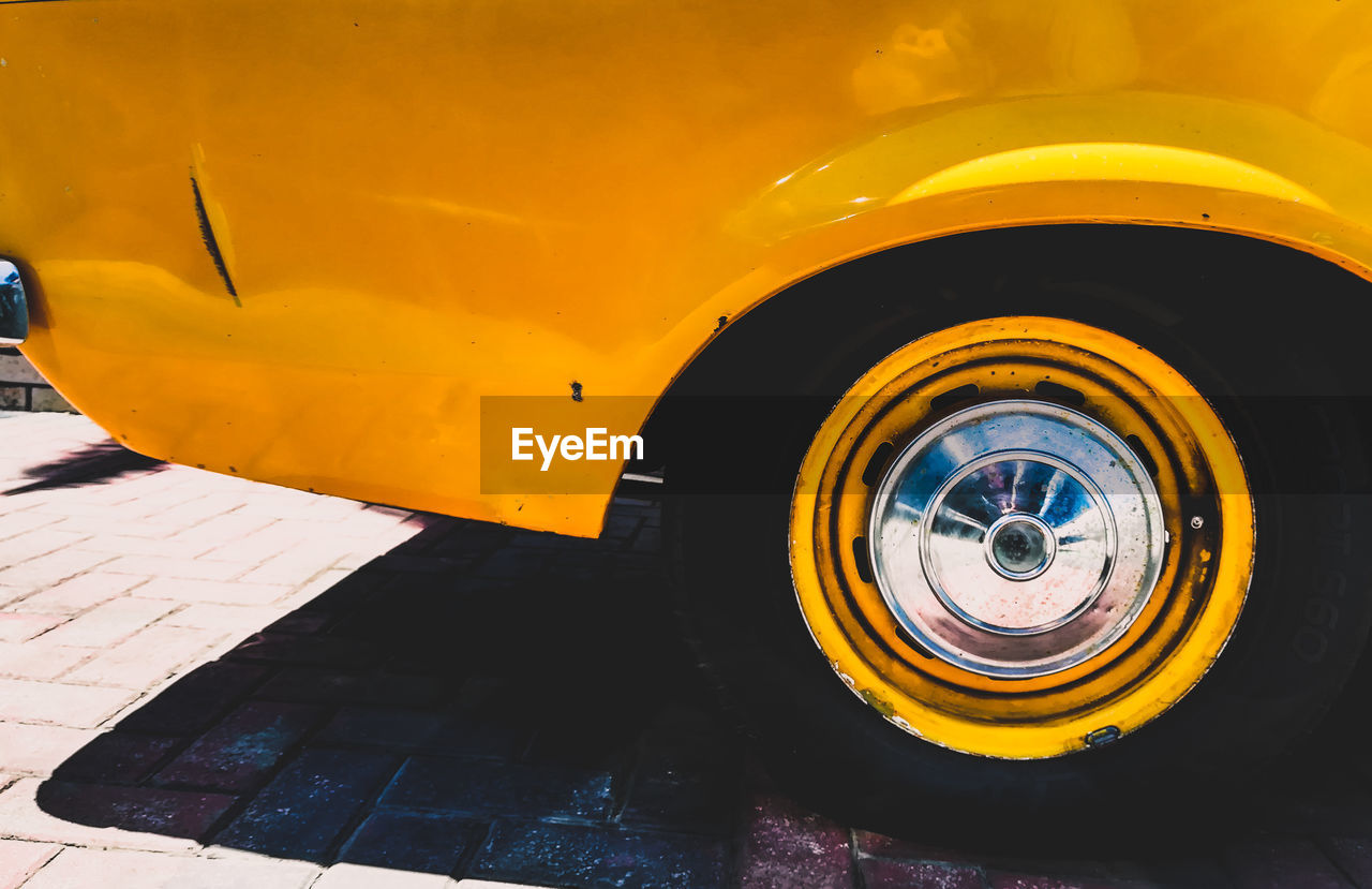 Close-up of yellow vintage car tire