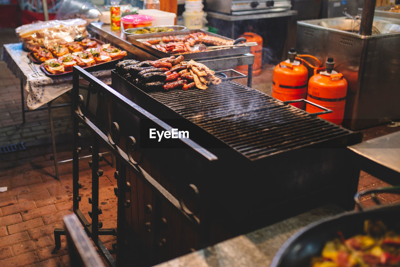 High angle view of meat on barbecue grill