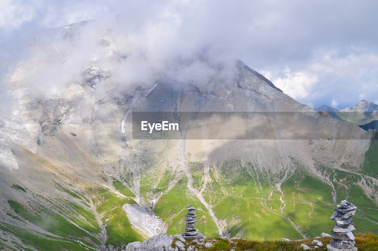 Stack of stones against landscape
