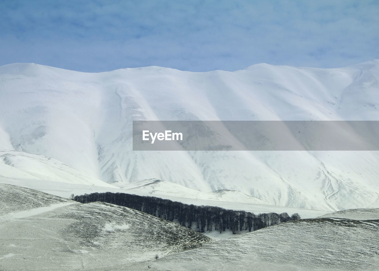 Scenic view of snowcapped mountain against sky