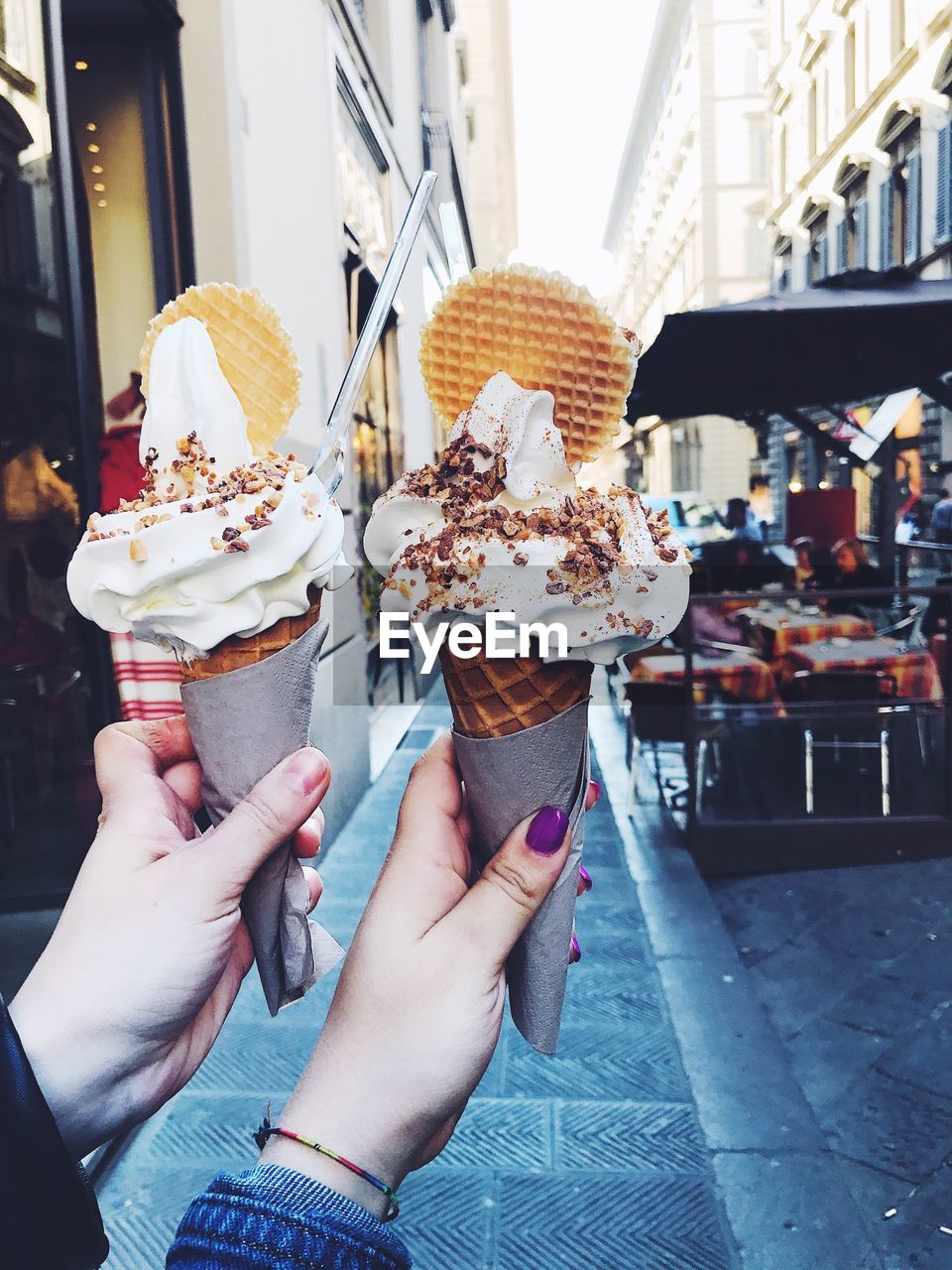 Couple holding ice creams