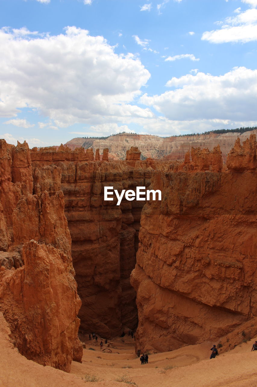 Scenic view of cliff against sky