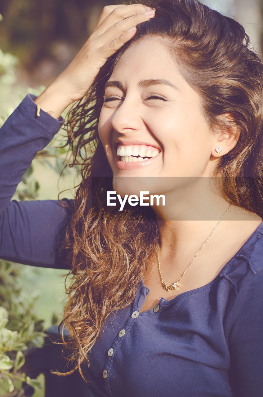 Smiling young woman with long hair