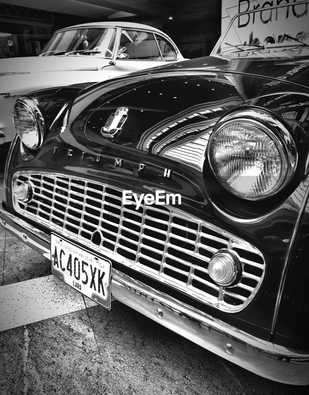 CLOSE-UP OF METAL GRATE AGAINST CAR