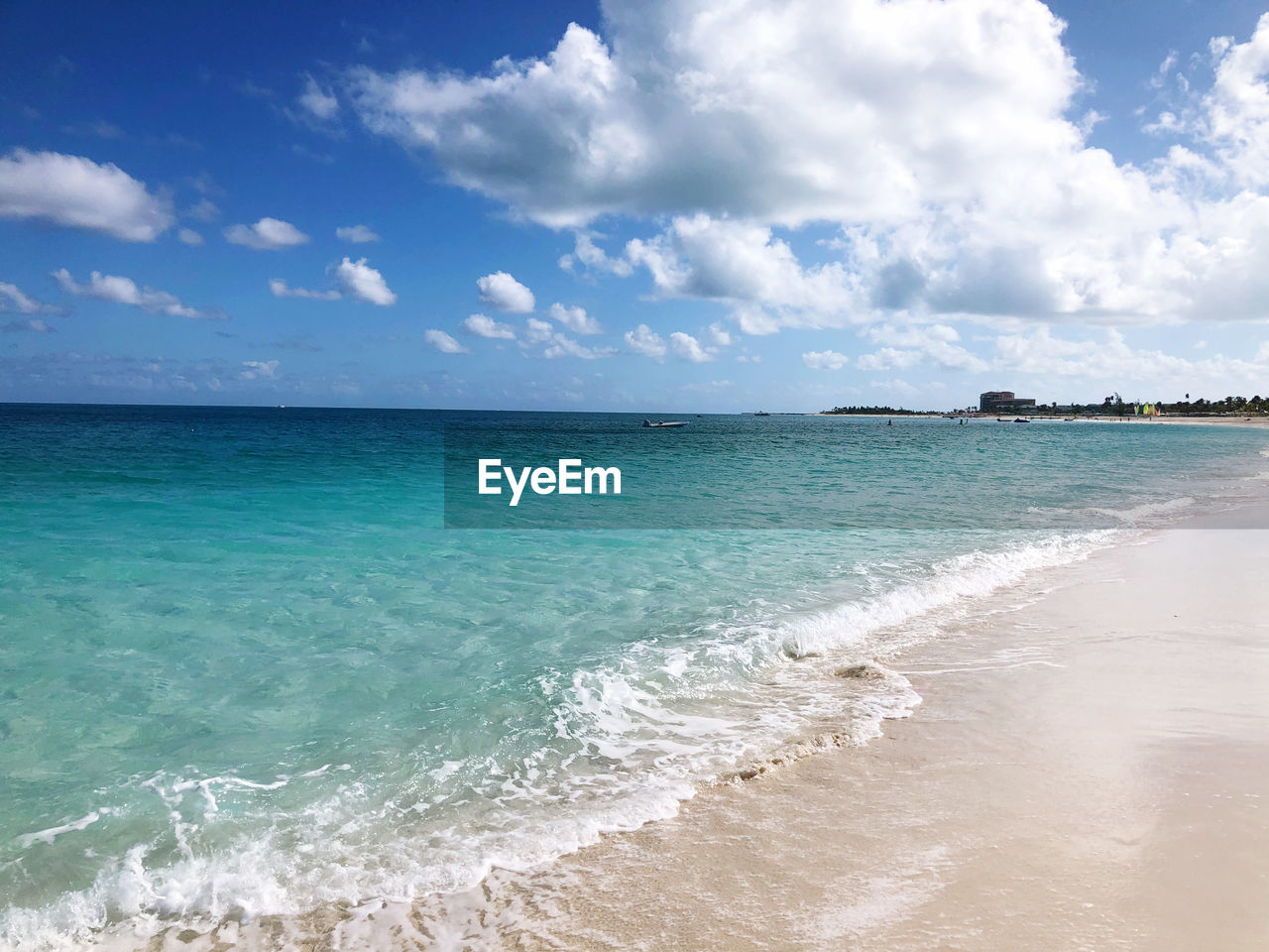 Scenic view of crystal clear sea against bright sky