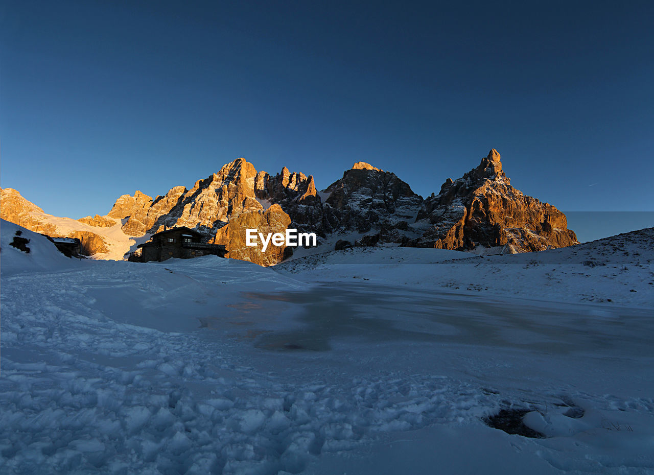 Italy, dolomities unesco heritage. scenic view of snowcapped  montains against clear sky. 