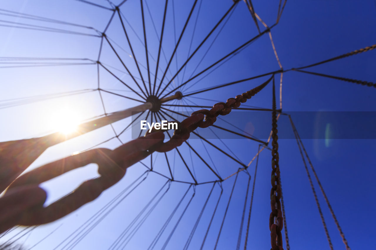 Low angle view of amusement park ride against sky