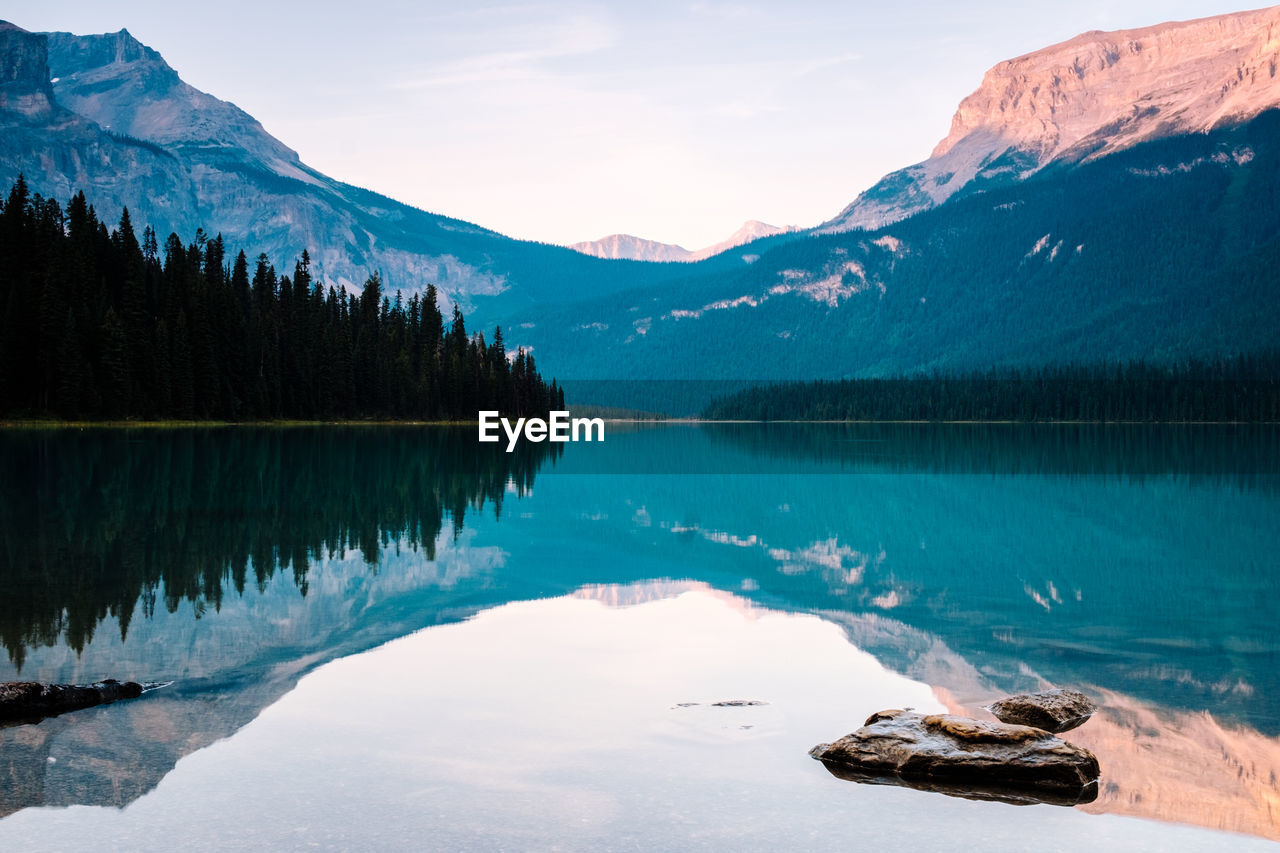 Scenic view of lake and mountains against sky