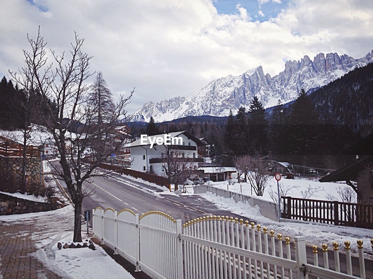 Road passing through town in mountain valley