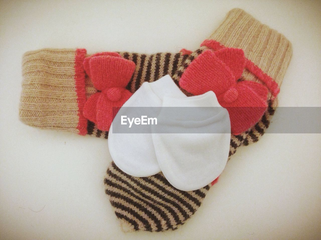 Close-up of socks over white background